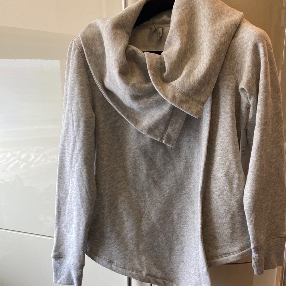 Grey jacket-workout wear.